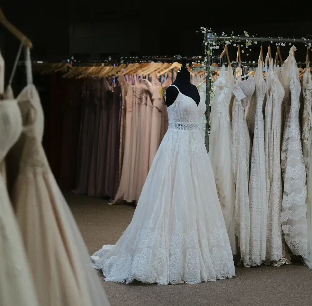 Bride celebrating after saying yes to her wedding dress